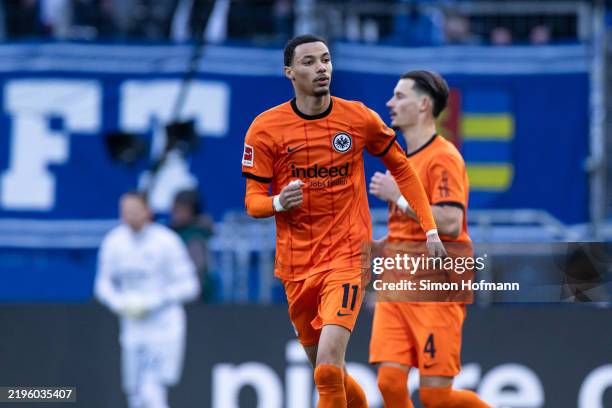 Hugo Ekitike of Frankfurt celebrates his side's first goal during the Bundesliga match between TSG 1899 Hoffenheim and Eintracht Frankfurt at...