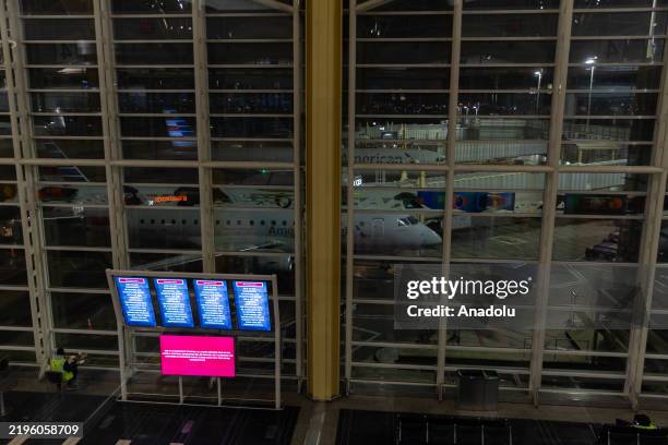 Signage displays an emergency message inside Ronald Reagan National Airport following a collision between an American Eagle flight and an Army...