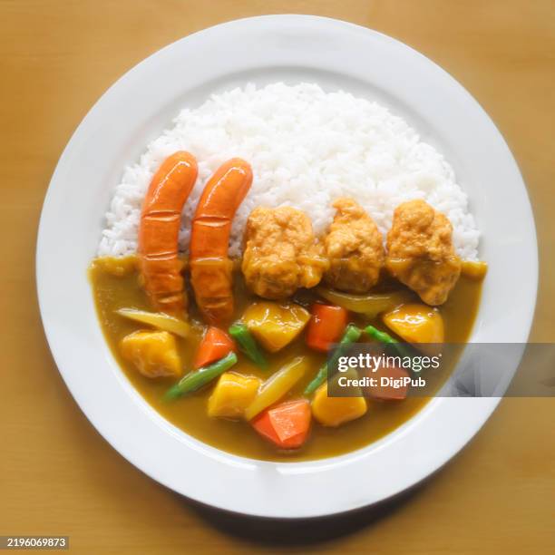 japanese vegetable curry with fried chicken and sausages food model - japanese curry stock pictures, royalty-free photos & images