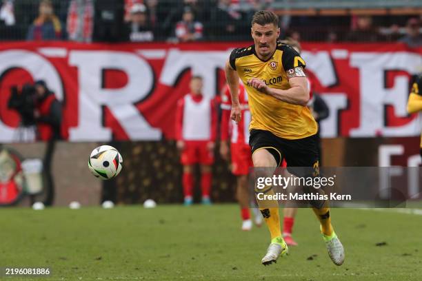 Stefan Kutschke of Dresden runs with the ball during the 3. Liga match between FC Energie Cottbus and Dynamo Dresden at LEAG Energie Stadion on...