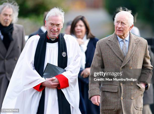 King Charles III, accompanied by The Reverend Canon Dr Paul Williams, attends the Sunday service at the Church of St Mary the Virgin, close to the...
