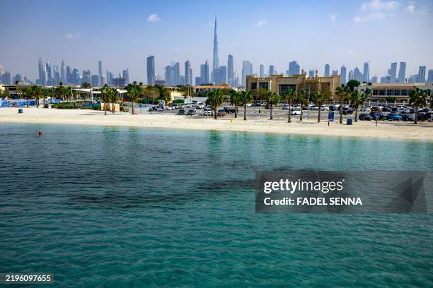 This picture taken from Jumerah beach shows the Dubai skyline, with Burj Khalifa, the world's tallest building seen in the centre on January 30, 2025.