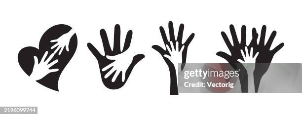 set of open hands in blue, different sizes, on a white background. - teamwork hands logo stock illustrations