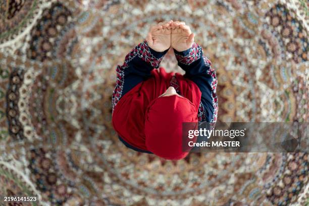 muslim woman praying in ramadan - praying stock pictures, royalty-free photos & images