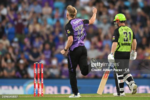 Nathan Ellis of the Hurricanes celebrates dismissing David Warner of the Thunder during the BBL The Final match between Hobart Hurricanes and Sydney...