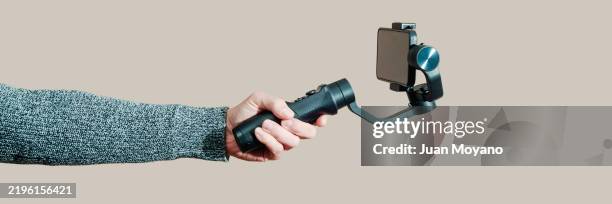 man using a phone stabilizer, banner format - fotografische ausrüstung stock-fotos und bilder