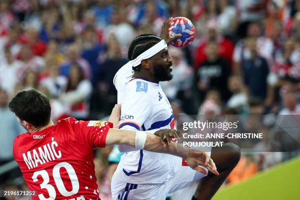 France's right back Dika Mem fighst for the ball with Croatia's left back Marko Mamic during the Men's Handball World Championship semi-final match...