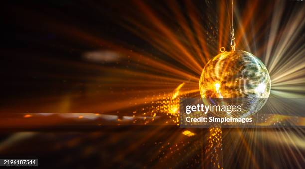 shiny disco balls on color background with blurred lights, space for text. bokeh effect - globo espelhado imagens e fotografias de stock
