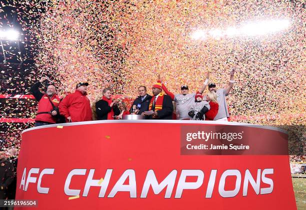 Head coach Andy Reid, owner Clark Hunt, Patrick Mahomes, and Travis Kelce of the Kansas City Chiefs celebrate after the Chiefs defeated the Buffalo...