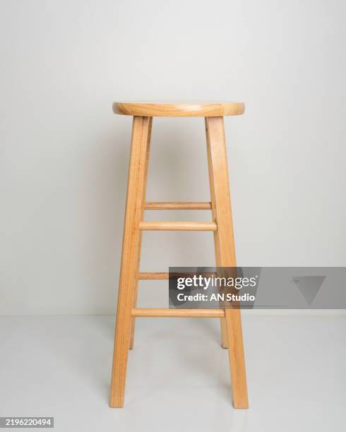 wooden bar chair isolated on white background. wooden light pine dining stool. natural, solid wood bench. - tabouret photos et images de collection
