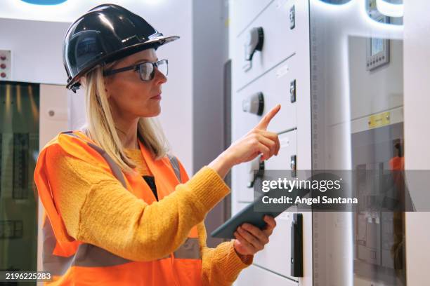 electrical engineer working in control room using digital tablet - thinking outside the box stock pictures, royalty-free photos & images