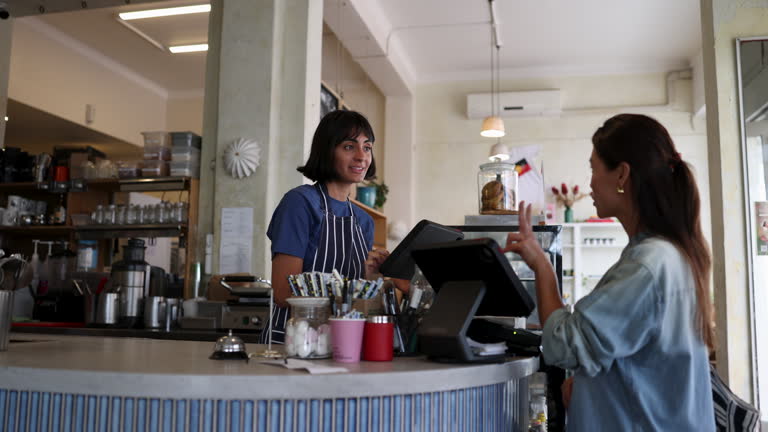 https://media.gettyimages.com/id/2196245593/video/female-customer-ordering-coffee-to-go-and-paying-with-her-smartphone-to-friendly-waitress.jpg?b=1&s=640x640&k=20&c=uI-clrj48jZz6PwVN2dP7iak467S-TBCJHE7NCb-Vg8=