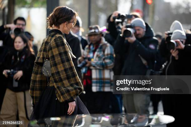 Ludovica Ragazzo wears a black lace see-through midi skirt, a mustard and black checked Dior co-ord set made of a corset and a puffy jacket while...