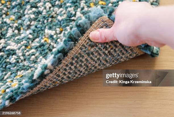 under the carpet - floor rugs stock pictures, royalty-free photos & images