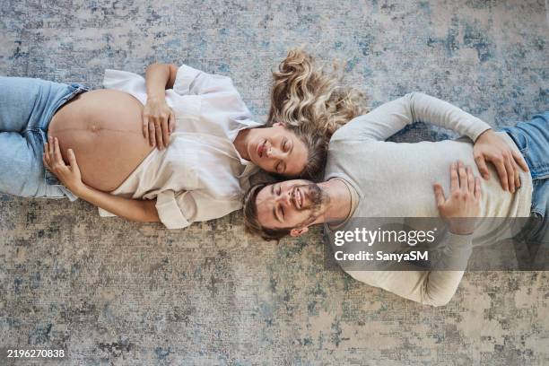 beautiful couple enjoying pregnancy - foetus stock pictures, royalty-free photos & images