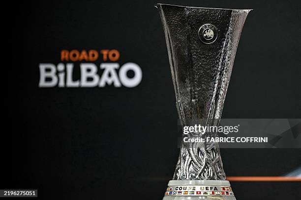 The trophy is on display before the 2024-2025 UEFA Europa League football tournament knockout play-off draw at the House of European Football in...