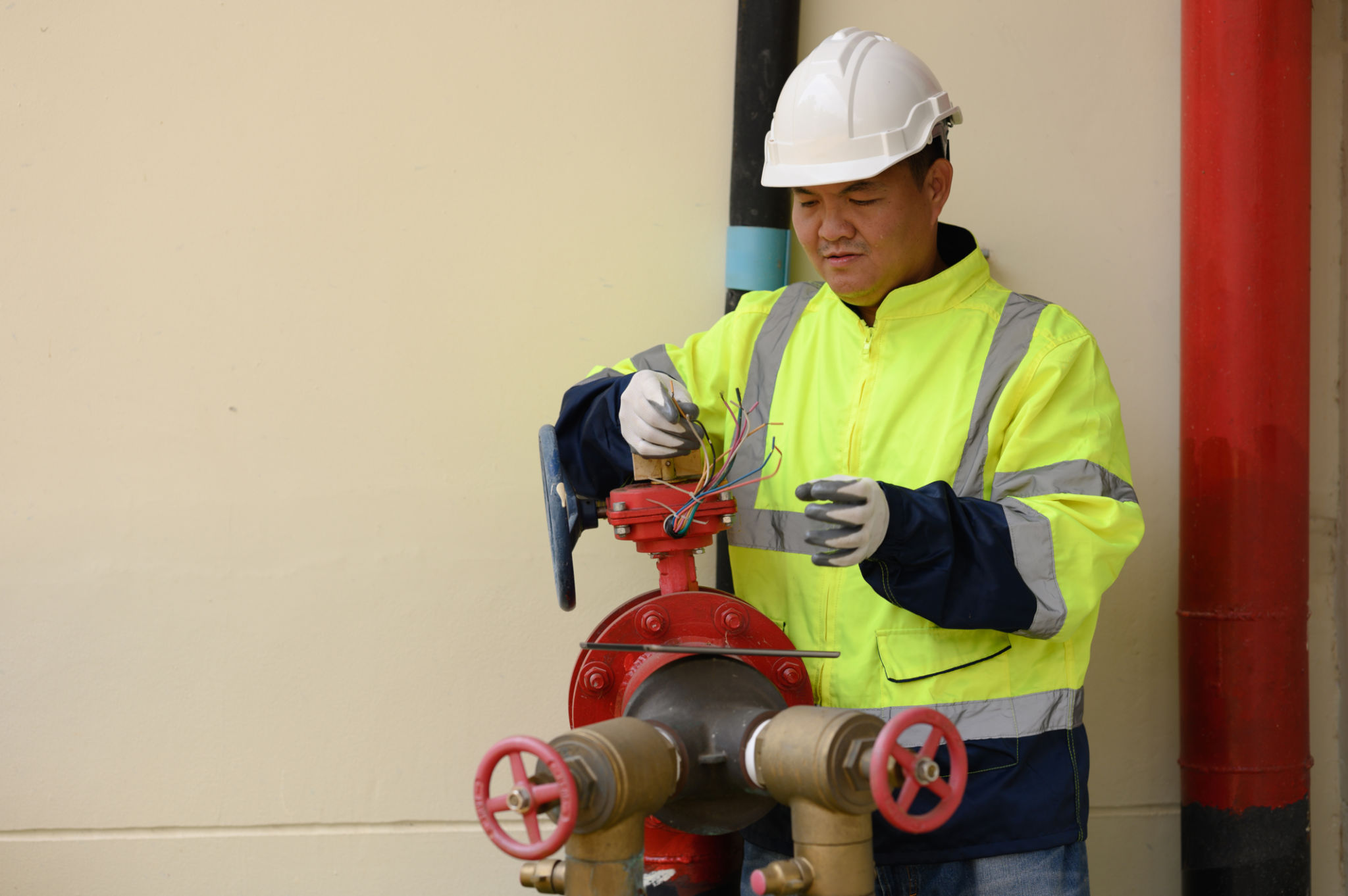 Engineers are checking the pipes and valves of the fire pump system. Engineers are checking the pipes and valves of the fire pump system.