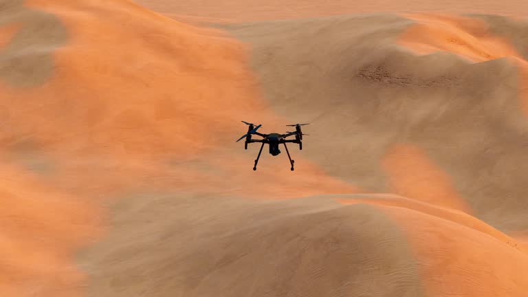 https://media.gettyimages.com/id/2196357478/video/rones-fly-over-desert-areas-for-geographical-exploration.jpg?b=1&s=640x640&k=20&c=XzUtZDyGf1oPWyKHAUJ18yjN9mAGqDlN7CEX5V1zVyo=
