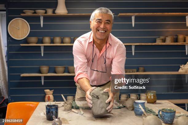 preparing the clay for pottery making - old man pottery stock pictures, royalty-free photos & images