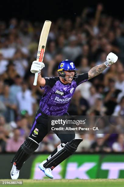 Ben McDermott of the Hurricanes celebrates scoring the match winning runs during the BBL The Final match between Hobart Hurricanes and Sydney Thunder...