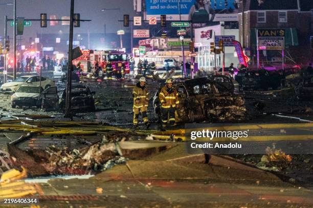 View of the wreckage from a small plane after it crashed in a residential area in the US city of Philadelphia on January 31, 2025. The aircraft,...