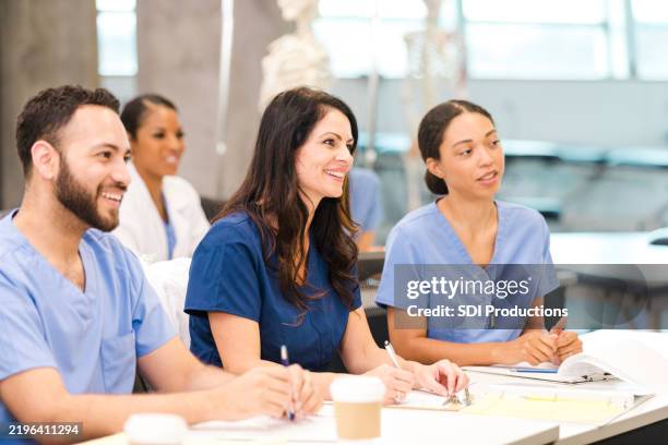 diverse group of medical students in a classroom setting - utbildningsbyggnad bildbanksfoton och bilder