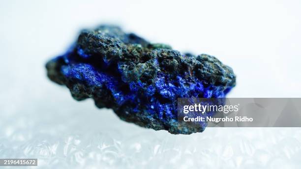 raw azurite gemstone on white background - blue mineral stock pictures, royalty-free photos & images
