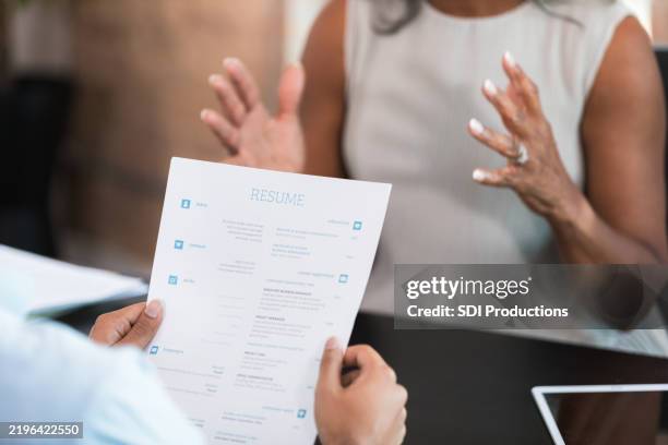 job interview: candidate shows resume to recruiter - cv bildbanksfoton och bilder