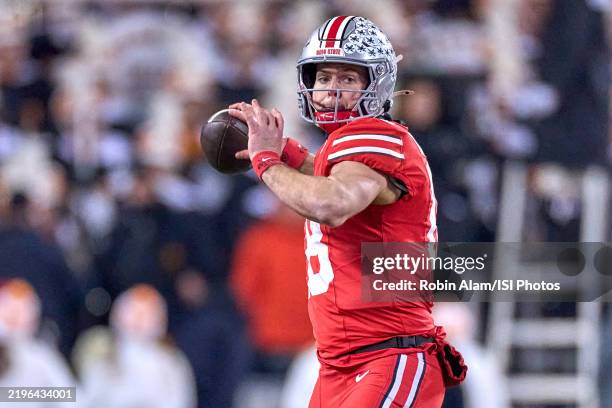 Quarterback Will Howard of the Ohio State Buckeyes throws the football in action during the College Football Playoff First Round game between the...