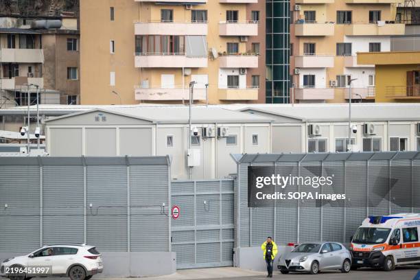 Man in front of the hotspot of Shengjin. Forty-nine migrants from Bangladesh, Egypt, Côte d'Ivoire, and Gambia arrived at Albania's Shengjin port...