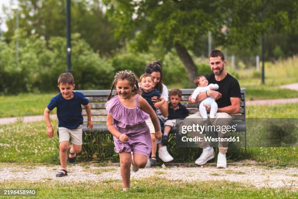 large family enjoying leisure time at playground - family with five children stock pictures, royalty-free photos & images