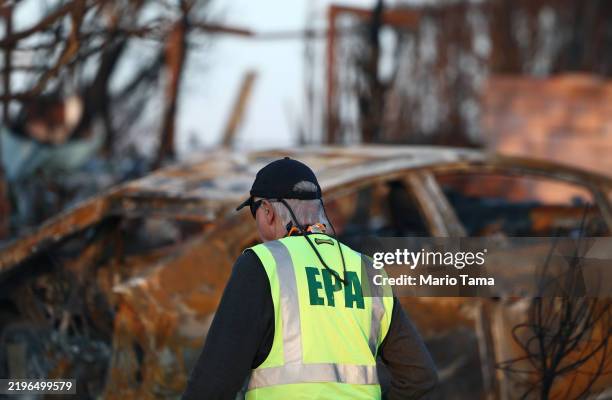 Environmental Protection Agency representative works in a residential area which burned in the Palisades Fire on January 28, 2025 in Pacific...