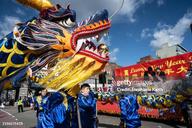 People participate in a parade celebrating the Lunar New Year in the Flushing neighborhood on February 1, 2025 in the Queens borough of New York...