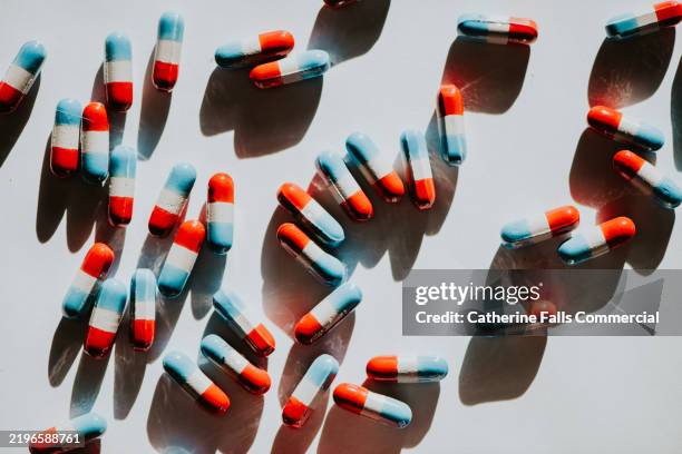 top down image of painkillers on a white surface - paracetamol stock pictures, royalty-free photos & images