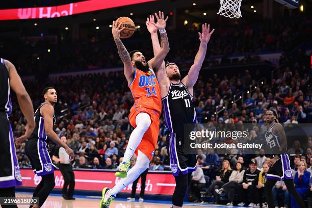 Kenrich Williams of the Oklahoma City Thunder attempts a shot during the first half against the Sacramento Kings at Paycom Center on February 1, 2025...