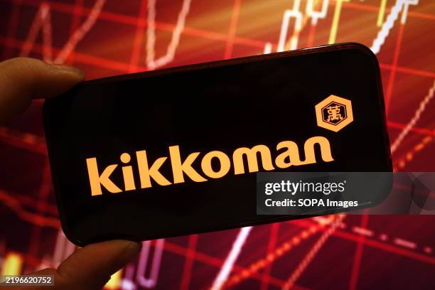 In this photo illustration, the Kikkoman company logo is seen displayed on a smartphone screen.
