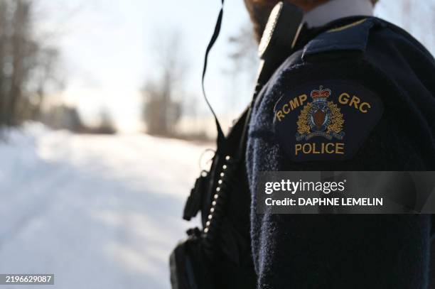 Royal Canadian Mounted Police Corporal Keven Rouleau patrols along the Canada-US border, near the border town of Stanstead, Quebec, Canada, on...