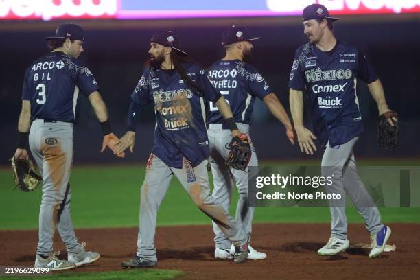 Mateo Gil, Billy Hamilton , Jack Mayfield and Donovan Casey of Mexico celebrate the victory after the game between Mexico and Venezuela as part of...