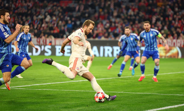 Harry Kane of Bayern Munich shoots during the UEFA Champions League 2024/25 League Phase MD8 match between FC Bayern München and SK Slovan Bratislava...