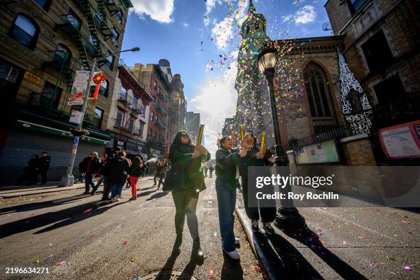 Participants fire a confetti cannon during the Chinese Lunar New Year celebrations in Chinatown, Manhattanon January 29, 2025 in New York City. 2025...