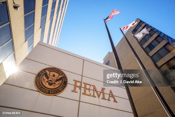 The sign flares behind the sign marking the location of the Federal Emergency Management Agency headquarters building on January 29 in Washington, DC.