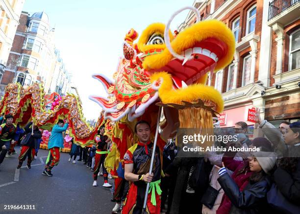 People participate in a Chinese New Year festival to mark the Year of the Snake on February 2, 2025 in London, England. 2025 is the Chinese zodiac...