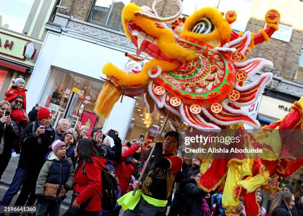 People participate in a Chinese New Year festival to mark the Year of the Snake on February 2, 2025 in London, England. 2025 is the Chinese zodiac...