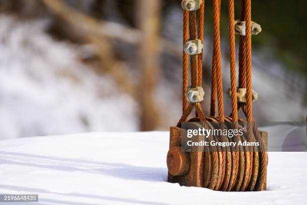 cable mount on a rusty old ski lift - ski lift isolated stock pictures, royalty-free photos & images