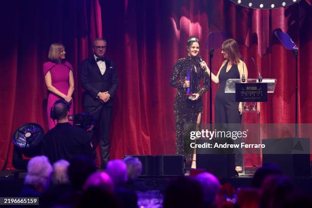 Abbi Pulling, 2024 F1 Academy champion, receives her trophy on stage, during the Autosport Awards 2025 at the Roundhouse on January 29, 2025 in...