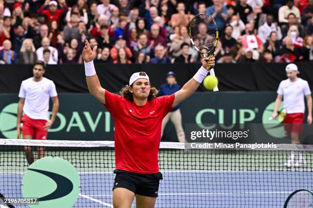 Liam Draxl of Canada celebrates in his doubles match against Peter Fajta and Mate Valkusz of Hungary during day 2 of the Davis Cup Qualifier first...