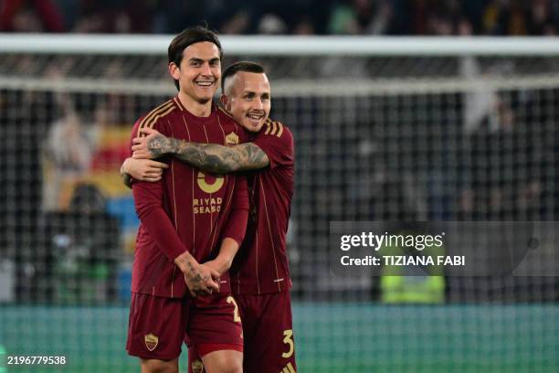 Roma's Spanish defender Jose Tasende celebrates with Roma's Argentine forward Paulo Dybala after scoring his team's first goal during the Italian...