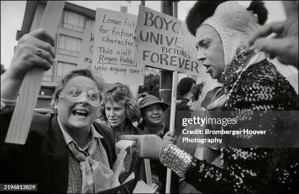 Fundamentalist Christians, some with signs, face off with a member of the Sisters of Perpetual Indulgence street performance group during a protest...