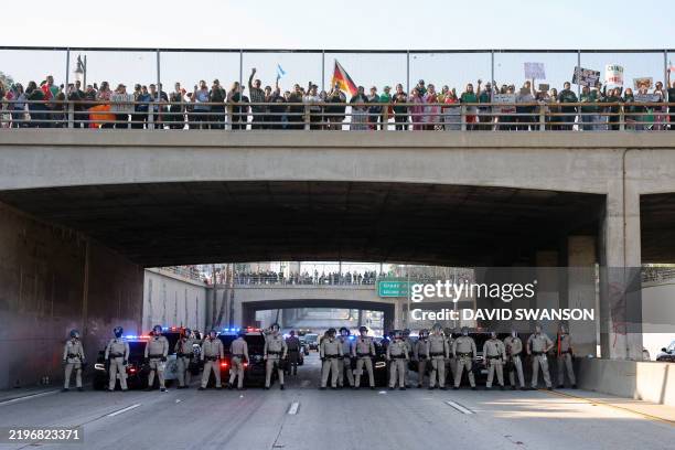 The LAPD response as protesters block the Santa Ana Freeway during a demonstration in support of immigrants in Los Angeles, California, on February...