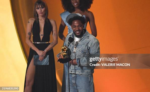 US rapper Kendrick Lamar accepts the Record of the Year award for ...